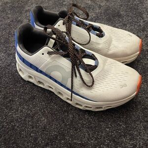 On Running White and Blue Athletic Shoes with Cushioning